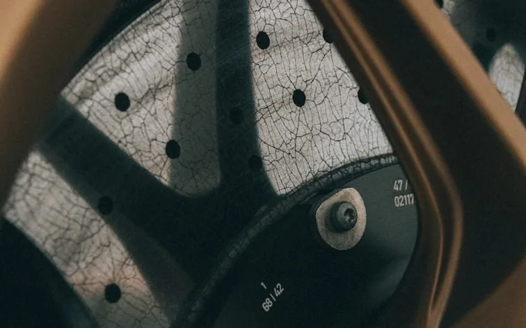 a drilled brake disc, close