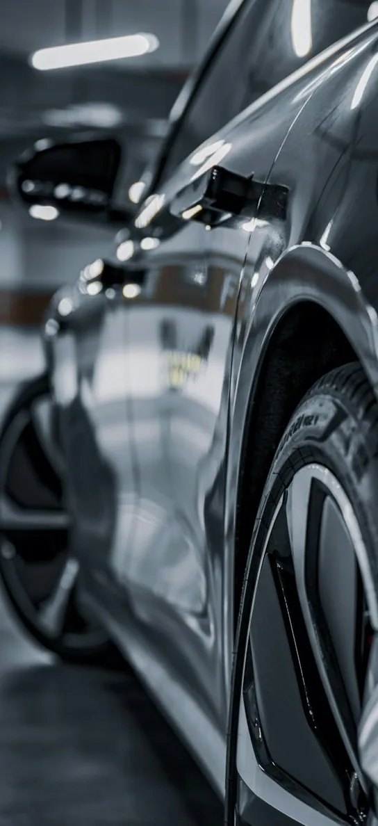 a car side-on, tall crop, car bleeding in from the left