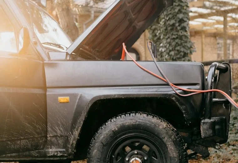 a mobile mechanic job — hands at work or a car with its bonnet up