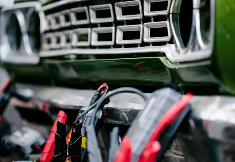a mobile mechanic job — hands at work or a car with its bonnet up