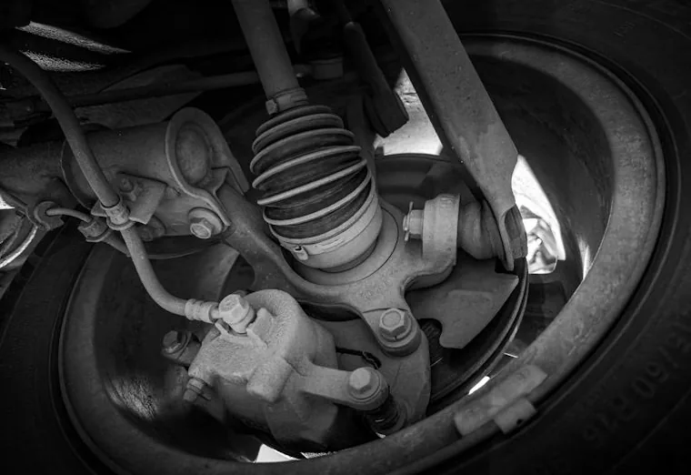 suspension and steering parts under a car